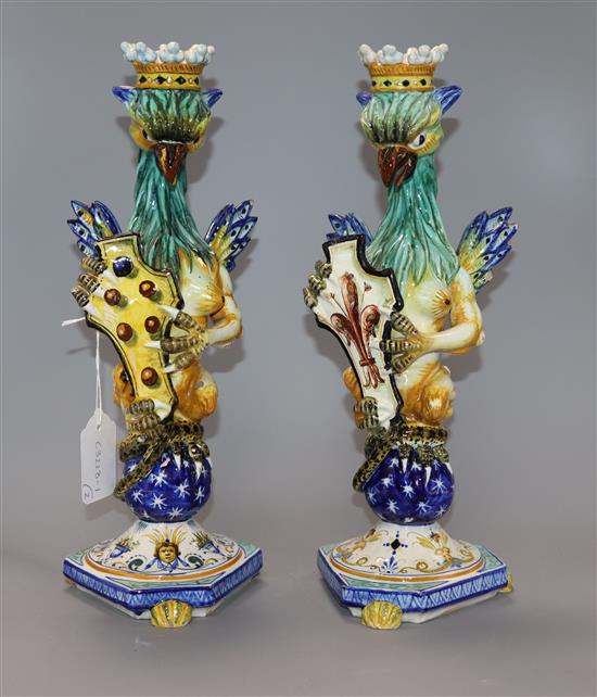 A similar pair of Cantagalli maiolica griffin candlesticks height 34cm